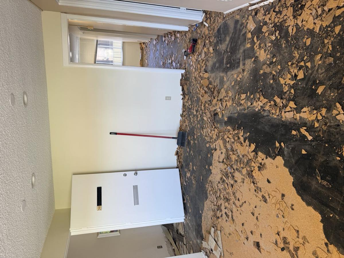 Bare, worn subfloor before SeaWolf Coatings epoxy install